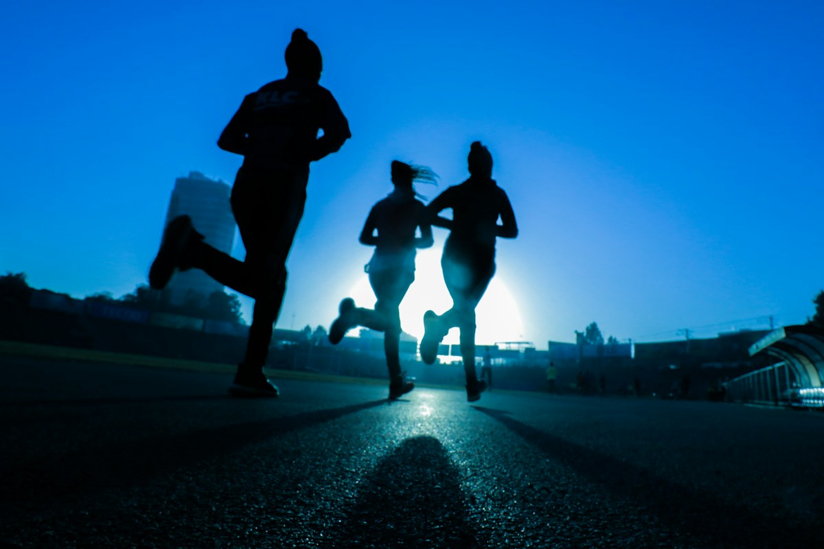 Runners training outdoors at sunrise
